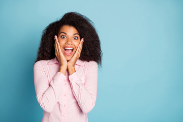 Photo of amazing wavy dark skin lady holding arms on cheekbones watching unbelievable sale shopping...