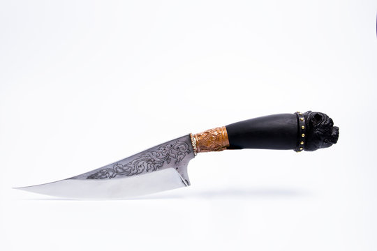 Pocket knife Hand-made knives Carved blade Thai pattern Black handle, American Bully head carving on white background