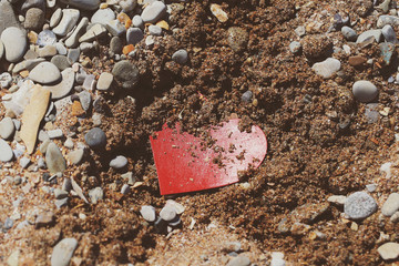paper bright heart buried in the ground