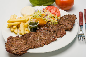 Grilled beef steak with rice and vegetables