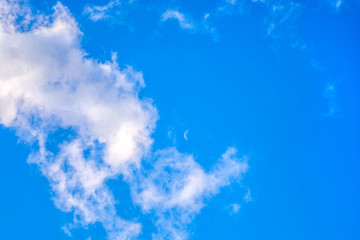 Fototapeta na wymiar Blue sky with clouds and moon