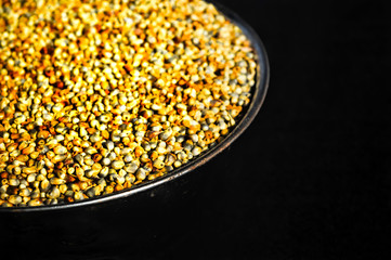 Millet in bowl,bajra seeds on black background,millet grain on black background