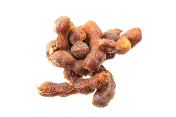 fresh tamarind fruits and leaves isolated on white