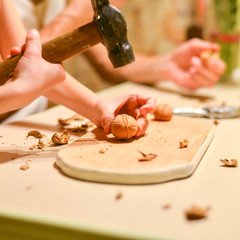  Child's hands beat nuts 