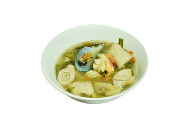 boiled shrimp and mussel with herb in Thai spicy tom yum soup on bowl