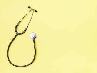 Stethoscope and space for text on color background