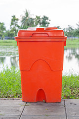Orange bin for receiving dangerous waste