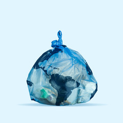 Garbage pack as a planet on blue background. Copyspace. Modern design. Contemporary colorful and conceptual bright art collage. Global warming, environmental and eco saving, plastic pollution concept. © master1305
