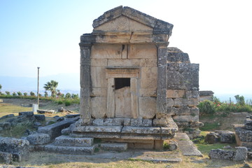 Old Hierapolis ruins, amphitheatre and touristic locations captured with hill background, in daytime.