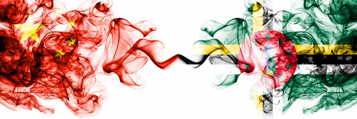 China, Chinese vs Dominica smoky mystic states flags placed side by side. Concept and idea thick colored silky abstract smoke flags