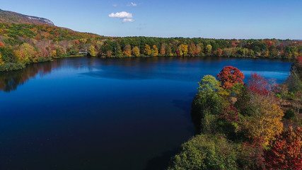 Obraz na płótnie Canvas Aerial drone view of lake in autumn state park.