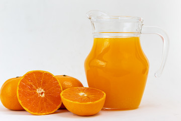 Naklejka na ściany i meble Orange juice in a glass jar Set on the table, white background