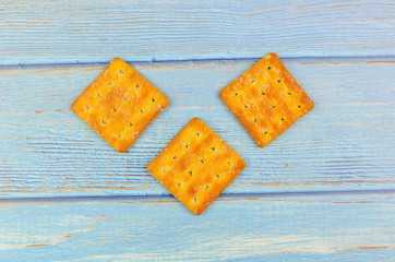 Sugar crackers on wooden background.