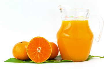 Orange juice in a glass jar Set on the table, white background