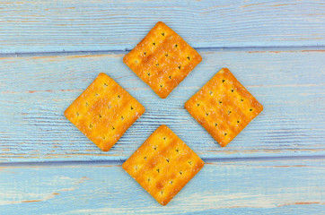 Sugar crackers on wooden background.