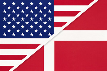 Fototapeta premium USA vs Denmark national flag from textile. Relationship between american and european countries.