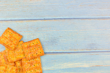 Sugar crackers on wooden background.