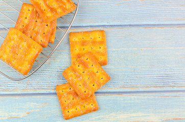 Sugar crackers on wooden background.