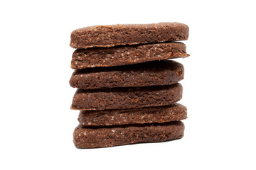 Delicious homemade chocolate and sugar cookies piled up on top of each other, isolated on a white background. Christmas baking for the whole family