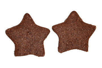 Top view on two delicious homemade chocolate and sugar cookies in the shape of stars isolated on a white background. Christmas or holiday baking for the whole family