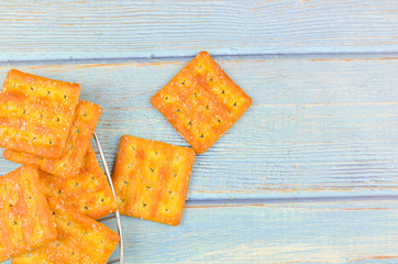 Sugar crackers on wooden background.