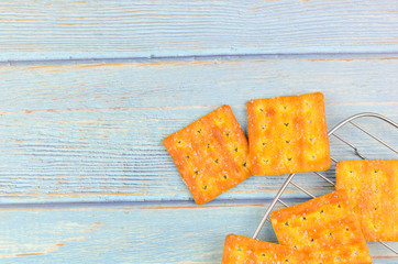 Sugar crackers on wooden background.