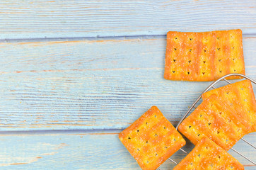 Sugar crackers on wooden background.