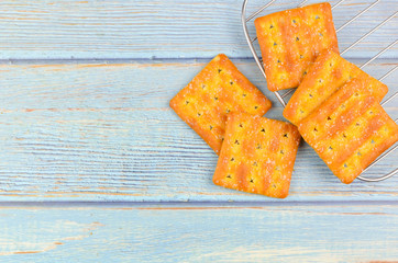 Sugar crackers on wooden background.