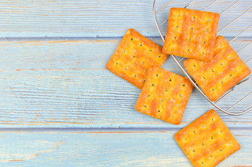 Sugar crackers on wooden background.