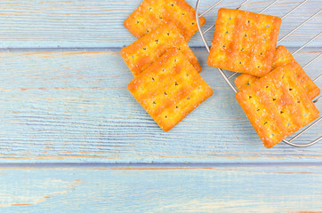 Sugar crackers on wooden background.