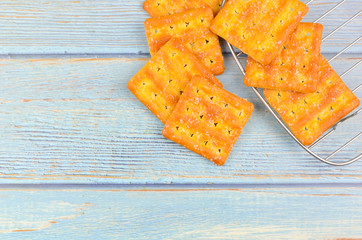 Sugar crackers on wooden background.