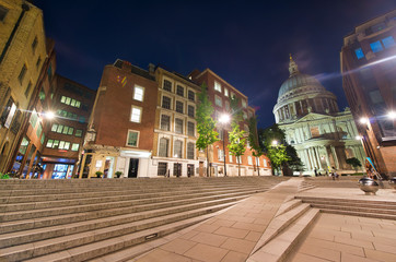 Fototapeta na wymiar Old buildings of London at night with St Paul Cathedral on the background, UK