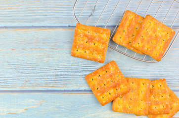 Sugar crackers on wooden background.