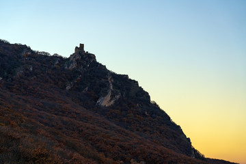 Fototapeta na wymiar View of ancient fortress of Chirag Gala on top of the mountain at sunset, located in Azerbaijan