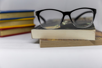 Glasses placed on books, placed on tables