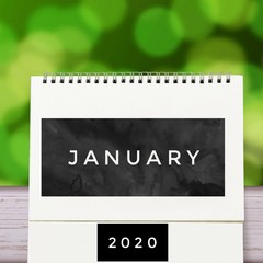 White blank paper desk spiral January calendar on wood with green abstract background. Calender of 2020 and empty month or Date to enter text and numbers.
