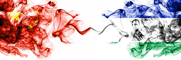 China, Chinese vs Lesotho smoky mystic states flags placed side by side. Concept and idea thick colored silky abstract smoke flags