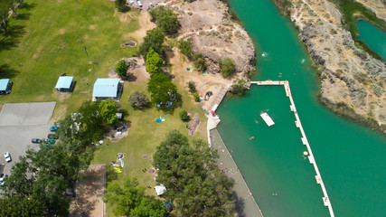 Panoramic aerial view of beautiful green lake in a mountain scenario