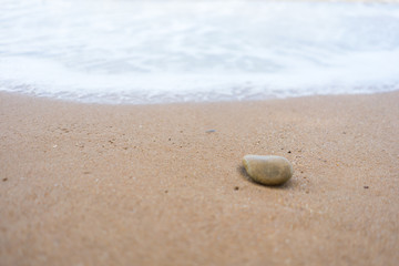 Stone on tropical beach