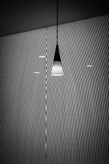 chandeliers with abstract black and white graphic background with oblique lines