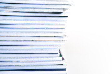 Stack of books on a white background, soft focus