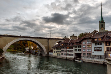 Fototapeta na wymiar Panoramic view of the Bern old town with the Aare river flowing around the town at sunset in Bern, Switzerland