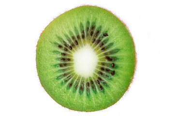 Fototapeta na wymiar Slice of fresh ripe kiwi isolated on white background. Green fruit, top view. Half of kiwi. Vegan or vegetarian healthy food, diet concept. Vitamin C.