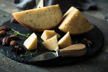 Fototapeta premium Cheese with nuts on the table, delicious snack