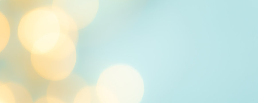 Abstract colorful defocused circular facula background banner. Festive Christmas and New Year with copy space