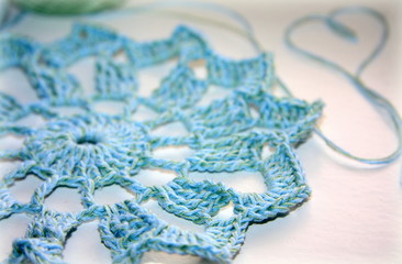 Needlework. Beautiful knitted blue napkin. Crochet.