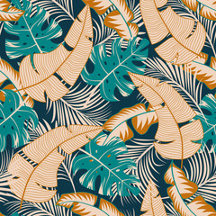 Trend seamless tropical pattern with bright yellow and beige plants and leaves on a blue background. Summer colorful hawaiian seamless pattern with tropical plants. Tropic leaves in bright colors.