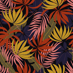 Summer seamless tropical pattern with bright red and yellow plants and leaves on a black background. Seamless pattern with colorful leaves and plants. Exotic jungle wallpaper. Hawaiian style.