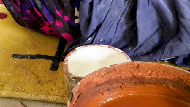 A woman makes pottery pieces