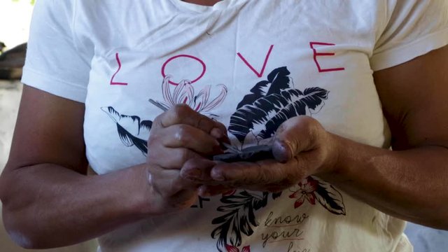 A woman makes pottery pieces